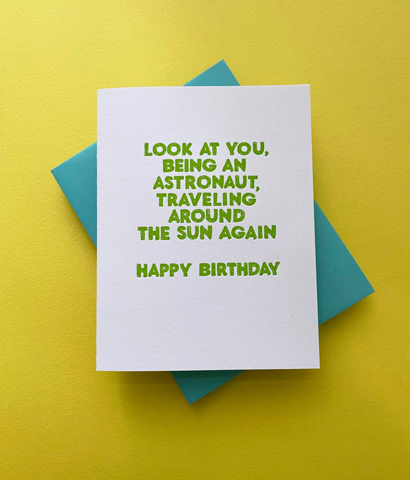 Astronaut Traveling Around the Sun Card