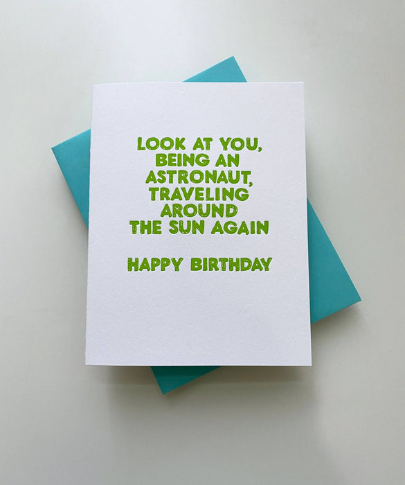 Astronaut Traveling Around the Sun Card